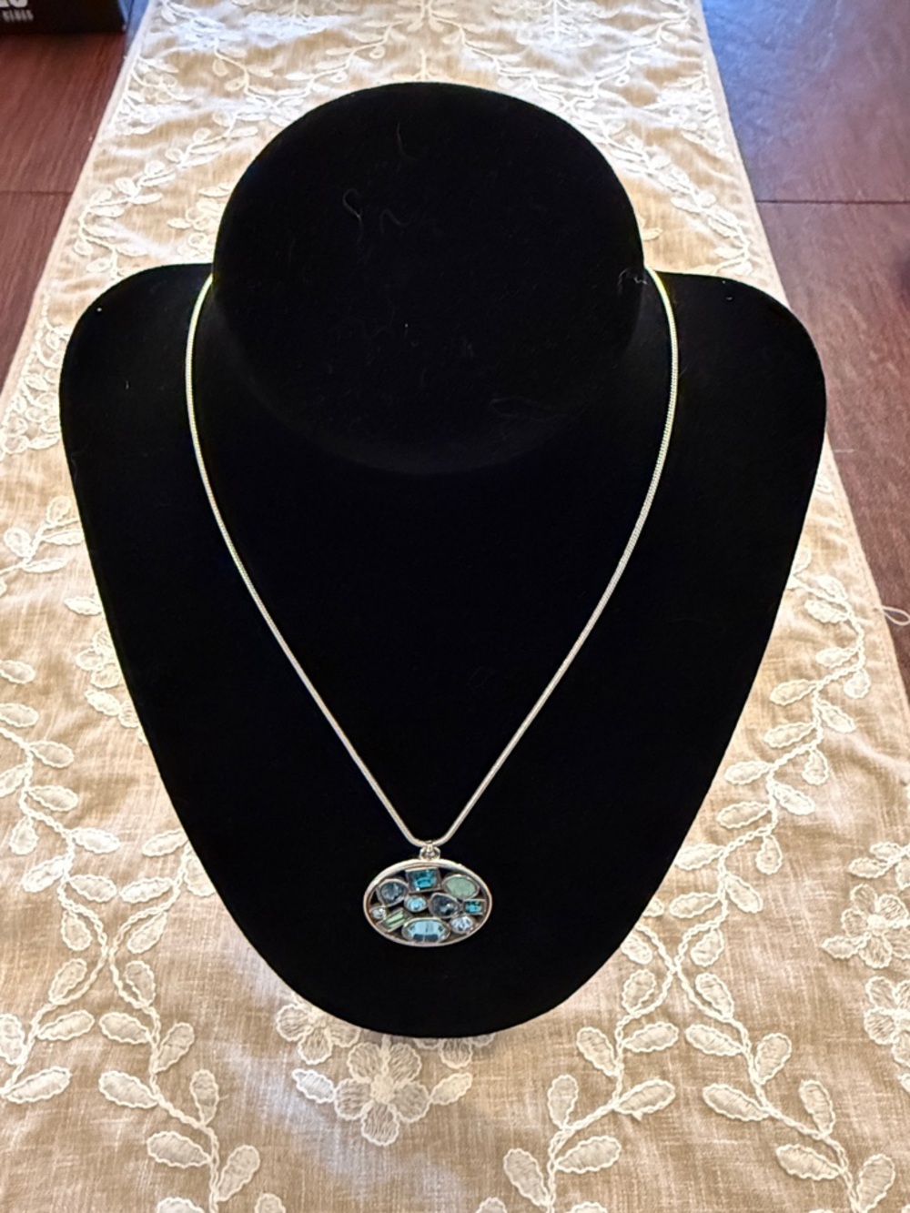Touchstone Crystal Silver Necklace with Blue Multi-Stone Oval Pendant